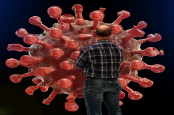 Picture Of Man Standing In Front Of COVID-19 Cell